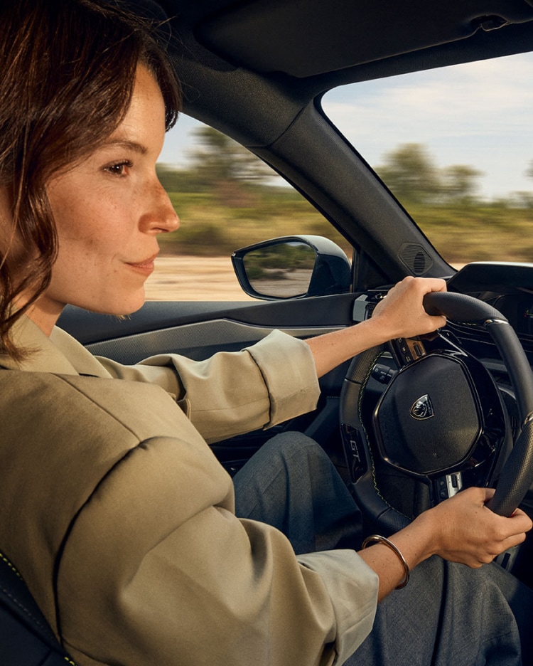 Woman in a PEUGEOT 308